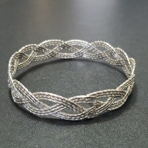 Silver tone braided bangle bracelet 7.75"